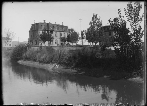 Stewart Hall, seen along the banks of a stream, University of Nevada, Reno