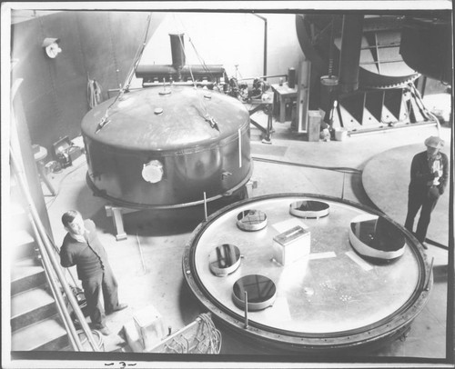 Secondary mirrors of the 100-inch and 60-inch telescopes, just after aluminizing in the tank, Mount Wilson Observatory