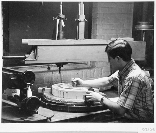 Robert Stiles applying a polishing compound to the cassegrain secondary mirror for the Palomar Observatory 60-inch telescope