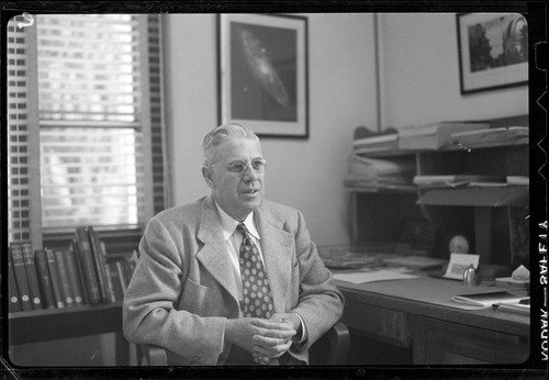 Milton L. Humason, seated at his desk, Mount Wilson Observatory