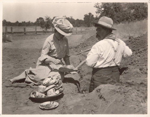 Grace Nicholson and William Benson (Pomo) excavating an Indian grave in Lake County, Calif., August 1906