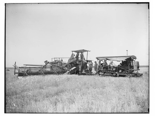 Combined harvester and farmers, Merced County