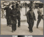 Four Chinese women in traditional clothing crossing a street in Old Chinatown, Los Angeles