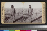 Portrait of a man standing in a harvested corn field