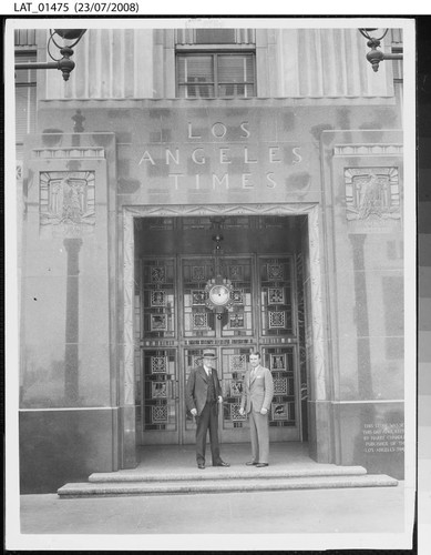 Harry Chandler and Norman Chandler in the entranceway to the "Globe" Lobby of The Times