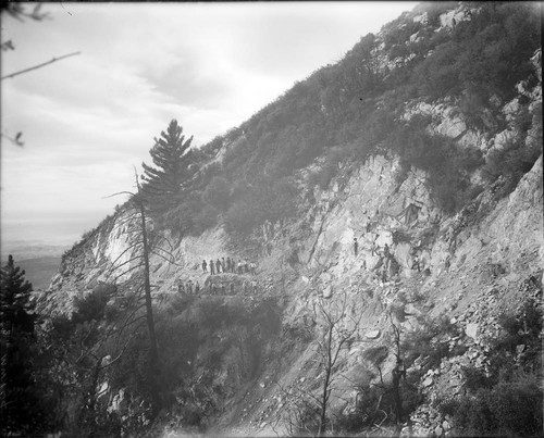 Construction workers widening a toll road below the Pasadena Gap, San Gabriel Mountains