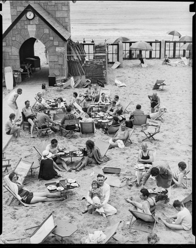 People sitting outdoors at Deauville Club in Santa Monica