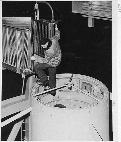 Bill Baum descending into the 200-inch telescope prime focus cage, Palomar Observatory