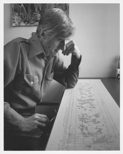 John Adkins, seated, reviewing a solar magnetic chart