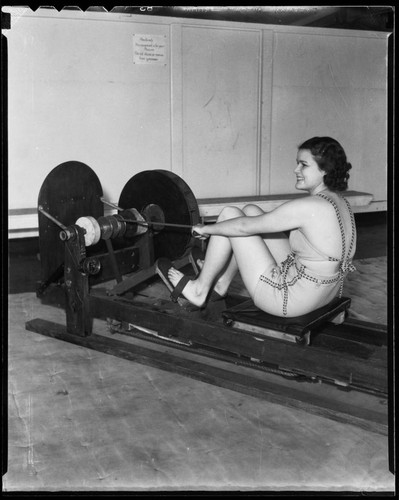 Woman at rowing machine, Santa Monica