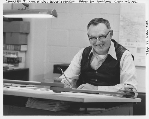 Charles E. Hartrick at his drafting table