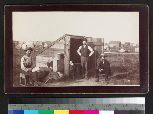 Shed with three men and a child