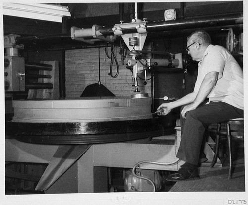 Floyd Day polishing the Palomar Observatory 60-inch telescope mirror, Pasadena