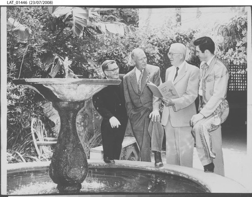 Four men honoring the memory of Harry Chandler on his birthday