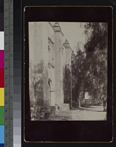 View of San Gabriel Mission with a small child in the doorway