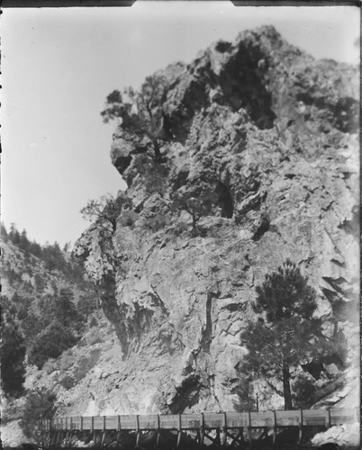 Unidentified mountain scene, showing sluice running below