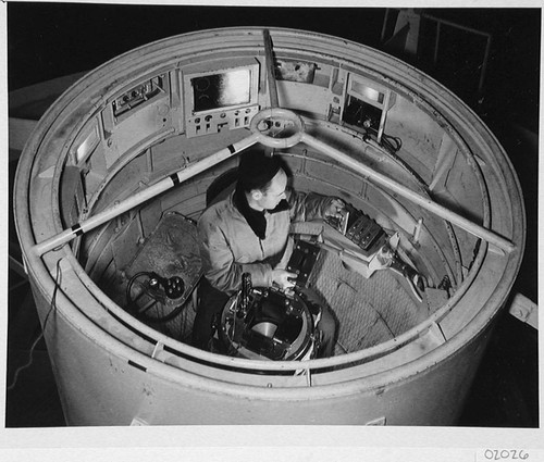 Bill Baum changing plateholders inside the 200-inch telescope prime focus cage, Palomar Observatory