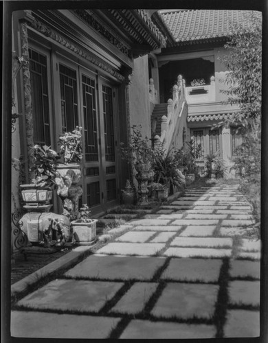 Detail of paving stones, planters and courtyard garden of Treasure House