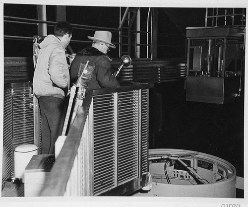 Wilson Hole and William C. Miller on the elevating platform at the 200-inch telescope, Palomar Observatory
