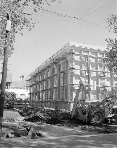 Construction workers applying the last coat of plaster to the exterior of the new wing of Mount Wilson Observatory's office building, Pasadena