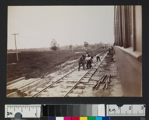 Men working on laying railroad tracks