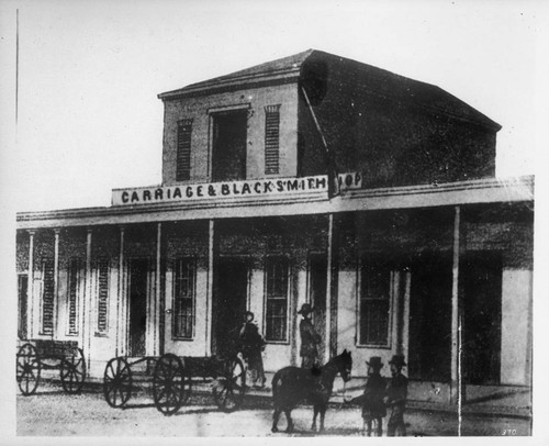 Carriage and blacksmith shop of John Goller (Los Angeles St. near Commercial), approximately 1875