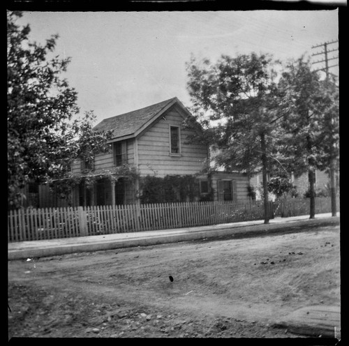 Unidentified two-story house on street