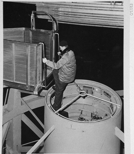 Bill Baum ascending the elevating platform from the 200-inch telescope prime focus cage, Palomar Observatory