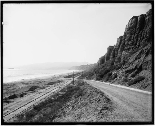 Railroad tracks and Long Wharf in distance along Santa Monica beach, California