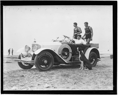 Jack Donovan and lifeguards in car on beach with dogs, Santa Monica, California