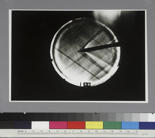 Shadow photograph of wind tunnel test results, showing air stream from a 30-degree cone head model