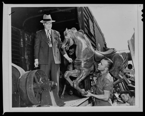 Robert Newcomb and merry-go-round horse