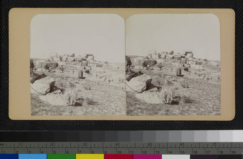 Cahuilla Indians attending to the graves at the cemetery at Cahuilla