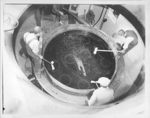 Preparing the mirror of the Hooker 100-inch reflecting telescope, Mount Wilson Observatory