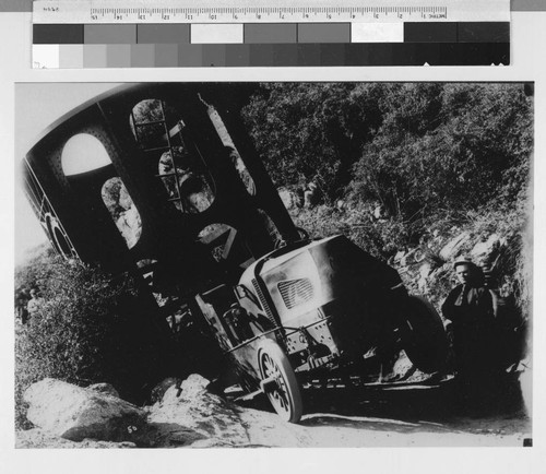 Truck transporting the lower section of the 100-inch telescope tube nearly off the road, Mount Wilson