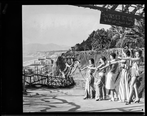 Models posing as archers near Sunset Trail at Palisades park, Santa Monica