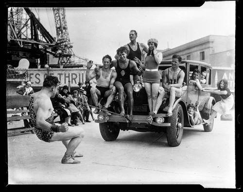 Strongman pulling people and car with his teeth, Santa Monica