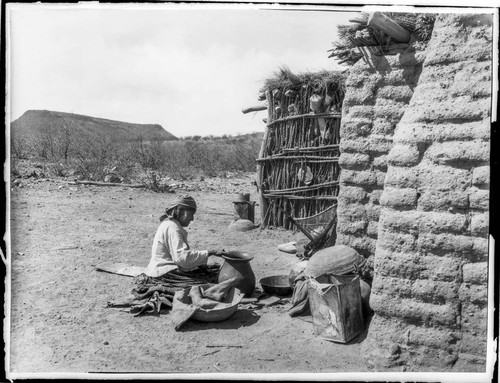 Tohono O'odham woman making pot