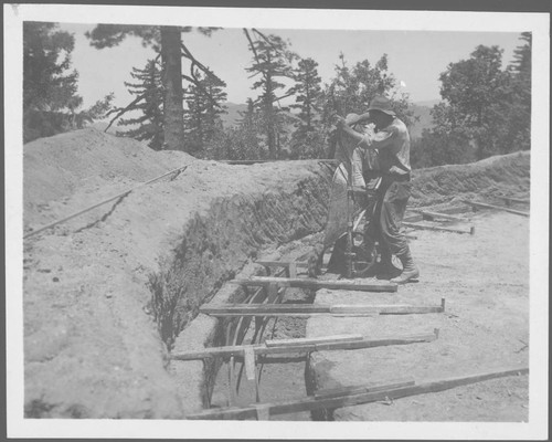 Pouring concrete for construction of water reservoir, Mount Wilson