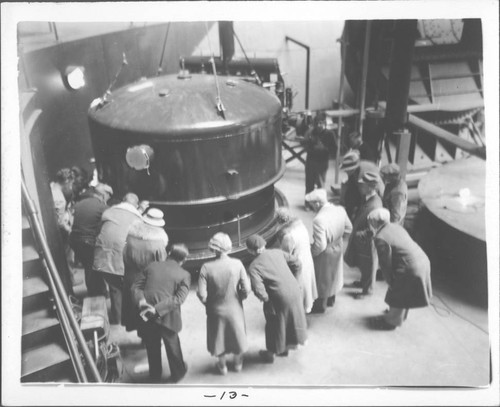 Crowd looking at newly aluminized 100-inch mirror, Mount Wilson Observatory