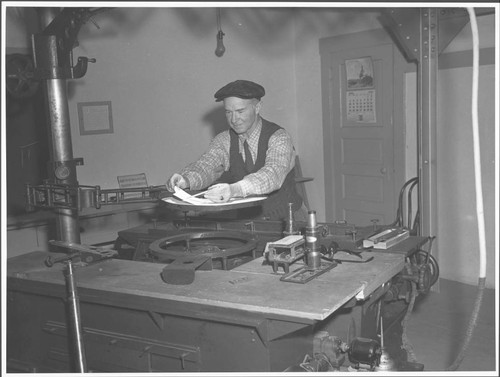 Joseph Hickox viewing a solar image in the 150-foot tower, Mount Wilson Observatory