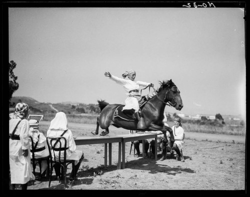 Single rider jumping his horse, Urban Military Academy, Brentwood, Los Angeles