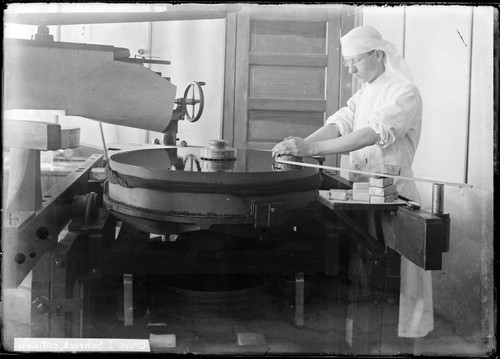 Charles I Schrock, grinding a mirror at the Mount Wilson Observatory Optical laboratory, Pasadena