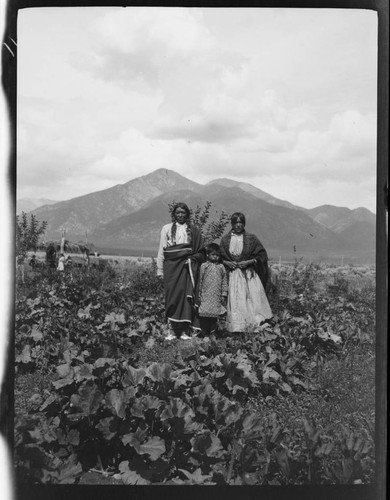 John Concha and wife and son, at their ranch, Taos