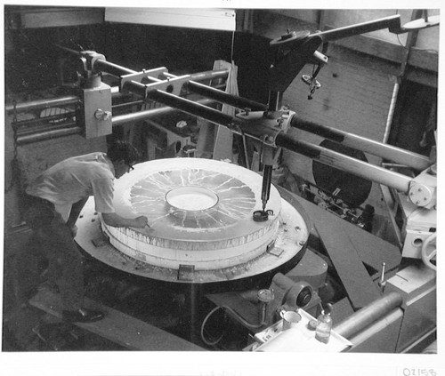 Grinding the outer portion of the Palomar 60-inch quartz disk; Robert Stiles at left