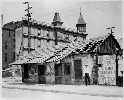 Passing of the adobes in Sonora Town. South East corner of New High & Ord Streets