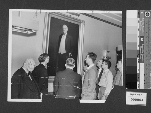 Men on tour of Los Angeles Times plant standing in front of portrait of Harrison Gray Otis