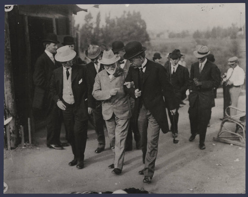 Candid photograph of Andrew Carnegie and George Ellery Hale, walking arm in arm