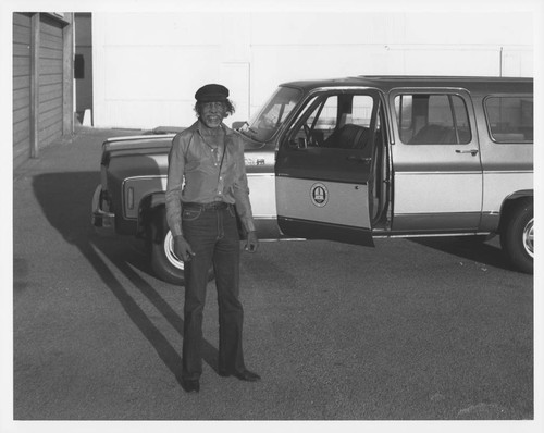 William Qualls standing by a truck at the Mount Wilson and Las Campanas Observatories Pasadena offices