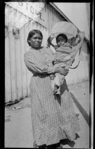 Native American woman with baby in cradle-board